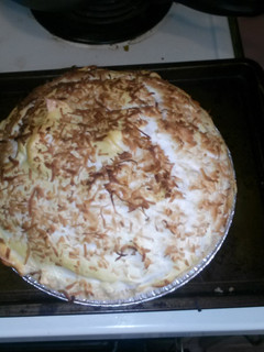 A picture of Guiltless coconut custard pie with sugar free meringue.
