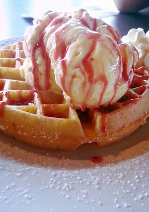 A picture of Berrilicous Waffles Topped with Icecream.