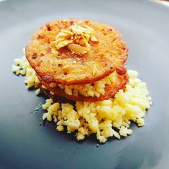 A picture of Sabudana and Rajma malpua sandwich with paneer crumble.