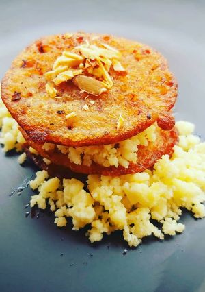 A picture of Sabudana and Rajma malpua sandwich with paneer crumble.