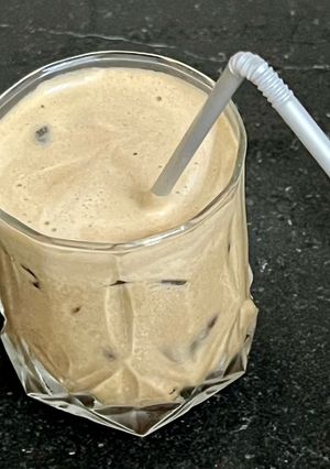 A picture of Iced coffee with no milk and no sugar.