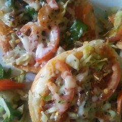 A picture of Mini pan pizza made with burger bun..