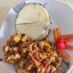 Yam and egg sauce with smoked Titus fish A picture of Yam and egg sauce with smoked Titus fish.