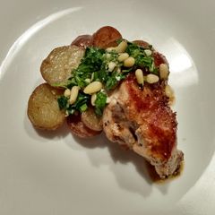 A picture of Pork tenderloin with marsala pan sauce and pine nut gremolata.