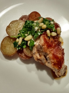A picture of Pork tenderloin with marsala pan sauce and pine nut gremolata.
