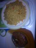 Peppered dried fish with jollof rice