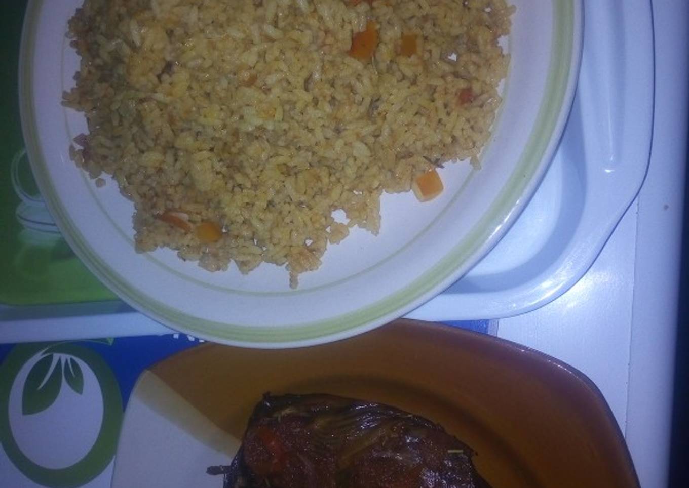 Peppered dried fish with jollof rice