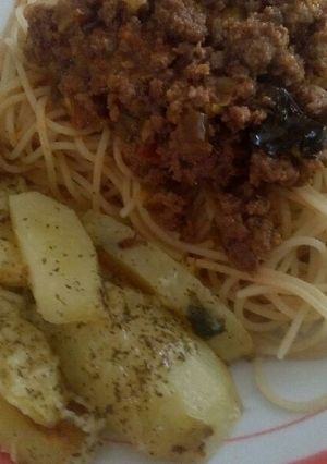 Una foto de Papas al horno con queso y orégano
