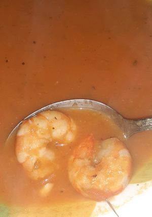 A picture of Tomato and shrimp tails soup.