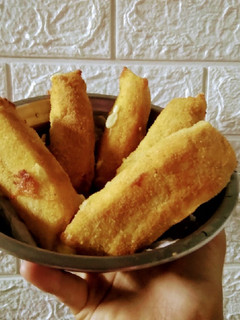 Una foto de Bastones de muzzarella y jamón