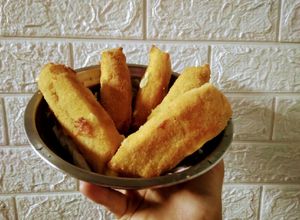 Una foto de Bastones de muzzarella y jamón