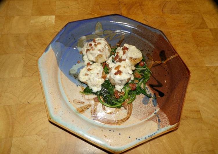 Seared Scallops with Wine Cream Sauce on Wilted Spinach Seared Scallops with Wine Cream Sauce on Wilted Spinach
