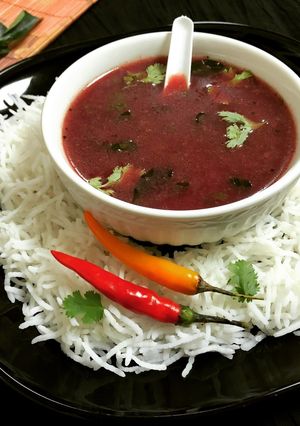 A picture of Black Grapes Gooseberry Rasam Soup.