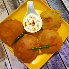 A picture of Pumpkin Puri With Raita.