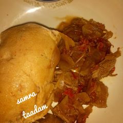 A picture of Moi moi with onion sauce.