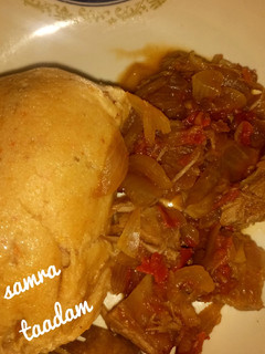 A picture of Moi moi with onion sauce.