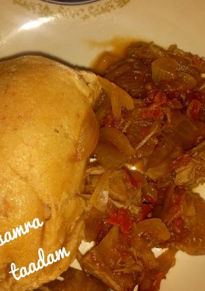 A picture of Moi moi with onion sauce.