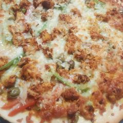 Chicken tikka pizza A picture of Chicken tikka pizza.