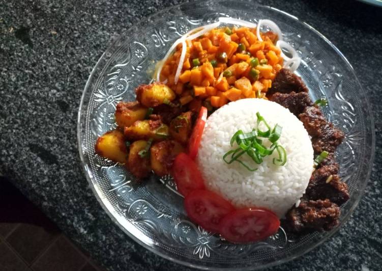 Carrot sauce, baked beef and potatoes and rice