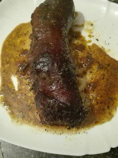 Una foto de Cochinillo relleno de carne picada de ternera beicon en GM f