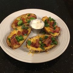 A picture of Crispy Bacon, Cheese and Onion Potato Skins.