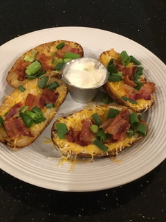 A picture of Crispy Bacon, Cheese and Onion Potato Skins.