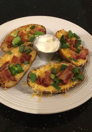 A picture of Crispy Bacon, Cheese and Onion Potato Skins.