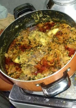 A picture of Egusi soup with ukazi leave.