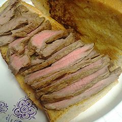 A picture of Steak on Cuban bread.