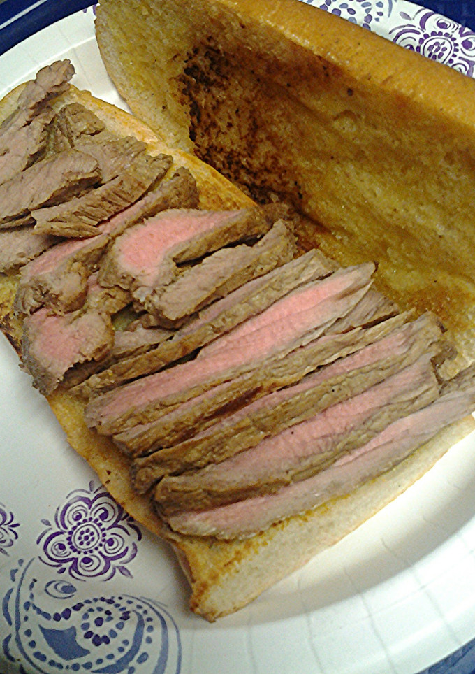 A picture of Steak on Cuban bread.