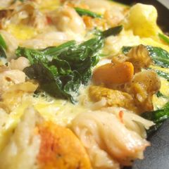 A picture of A Special Tamagoyaki with Scallops and Crabsticks.