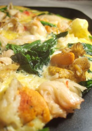 A picture of A Special Tamagoyaki with Scallops and Crabsticks.