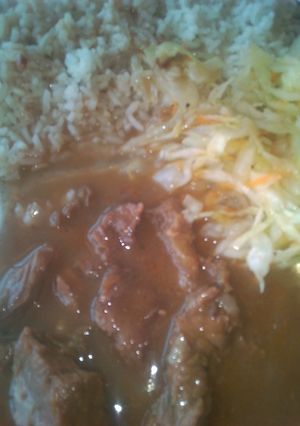 A picture of Beef stew and steamed cabbage.