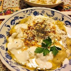 A picture of Turkish Manti (Boiled Dumplings).