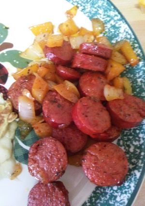 A picture of Breakfast (beef)sausage and onions.