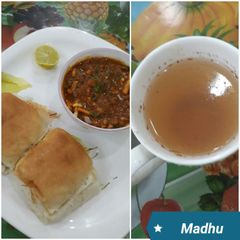A picture of Missal Pav with Cinnamon Ginger Tea.