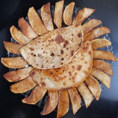 A picture of Mexican Tacos with Potato Chips.