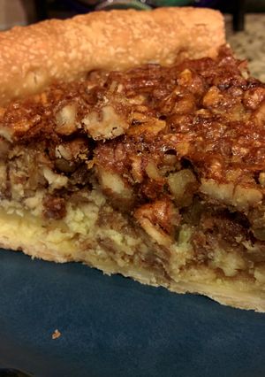 A picture of Pecan Pie with Cream Cheese Filling.