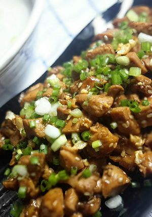 A picture of Chicken soy sauce with rice congee or plain rice soup.