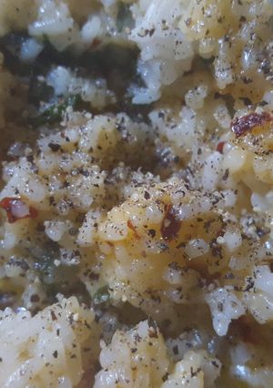 A picture of Spicy rice with spinach and velveeta cheese.
