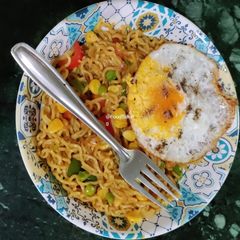 A picture of Masala Maggie With Egg Poach.