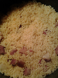 A picture of Saffron rice and ham.