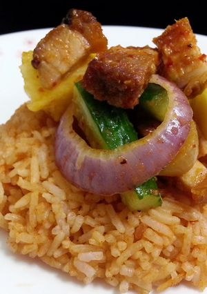 A picture of Korean Sesame Bean Paste Rice Topped with Spicy Roasted Pork Salad.