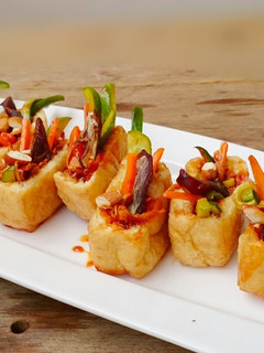 A picture of Honey Ginger Tofu Salad With Almond And Medjool Dates Appetizer.