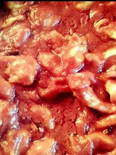 A picture of Chicken with tomato sauce.