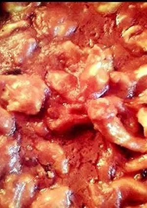 A picture of Chicken with tomato sauce.