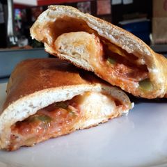 A picture of INCREDIBLY DELICIOUS stromboli.