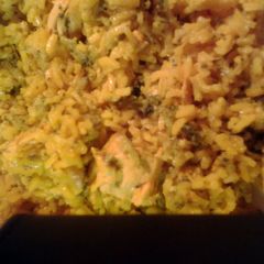 A picture of Italian chicken broccoli and yellow rice.