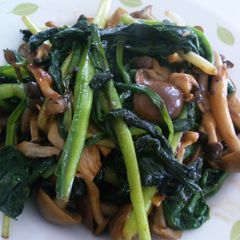 A picture of Ramps and Mushroom Consommé Butter Stir-fry.