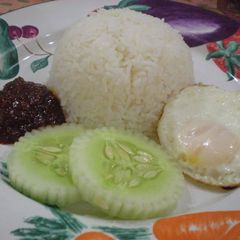 A picture of Nasi Lemak (Rice Cooked in Coconut Milk).